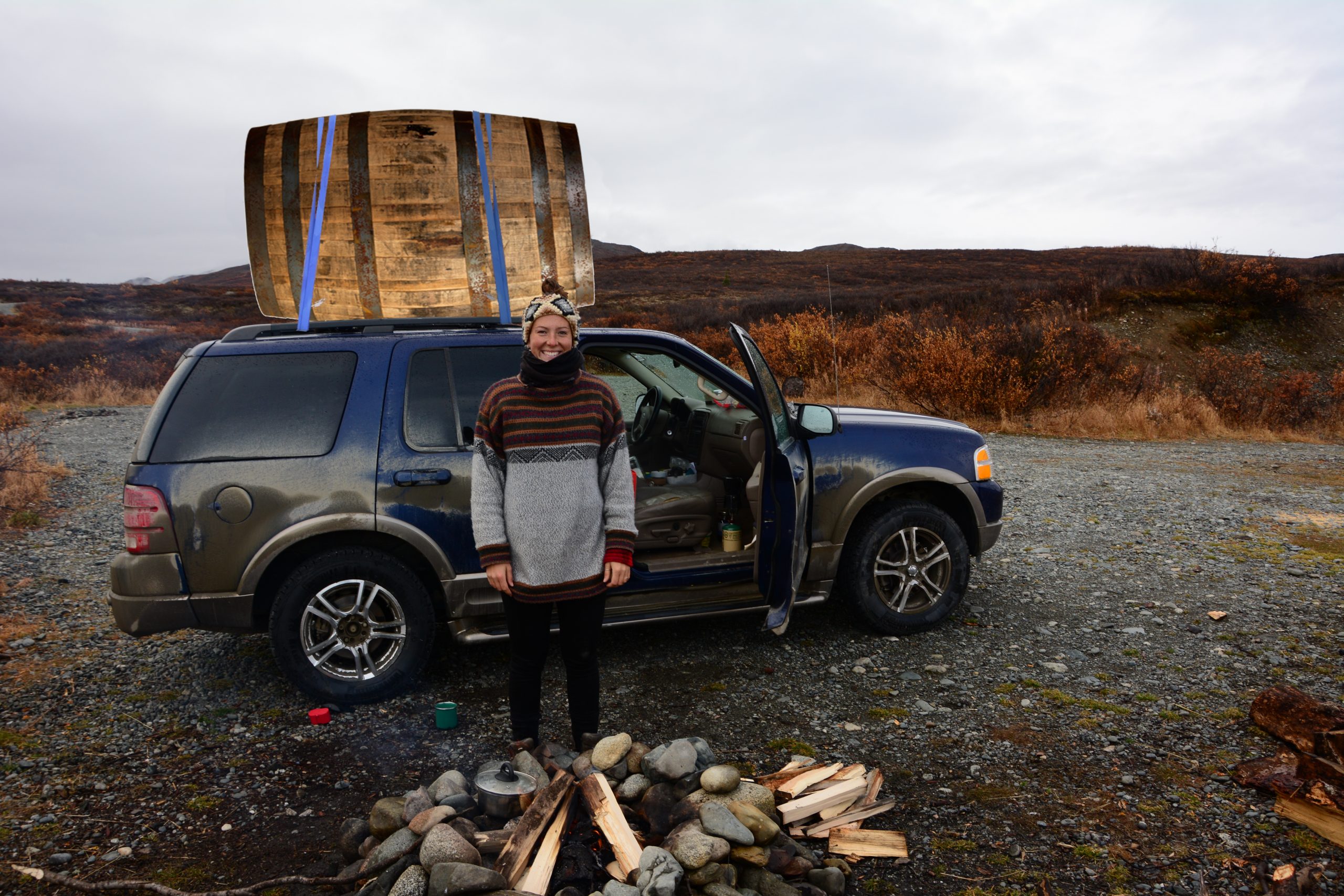 camping with barrel on car roof